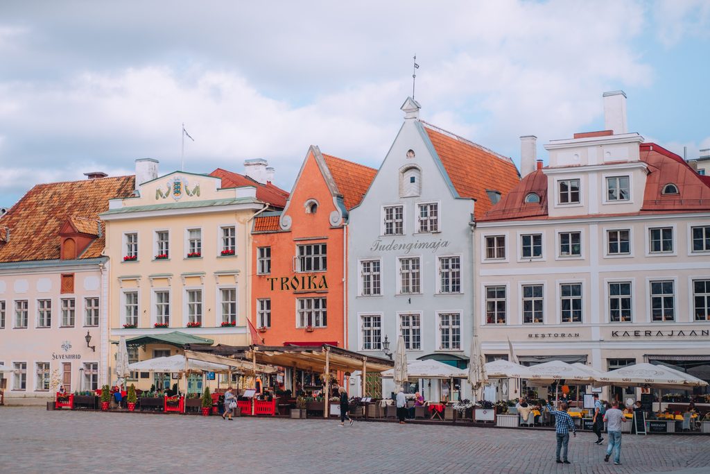 Colourful historic buildings on Tallinn Town Hall Square in summer